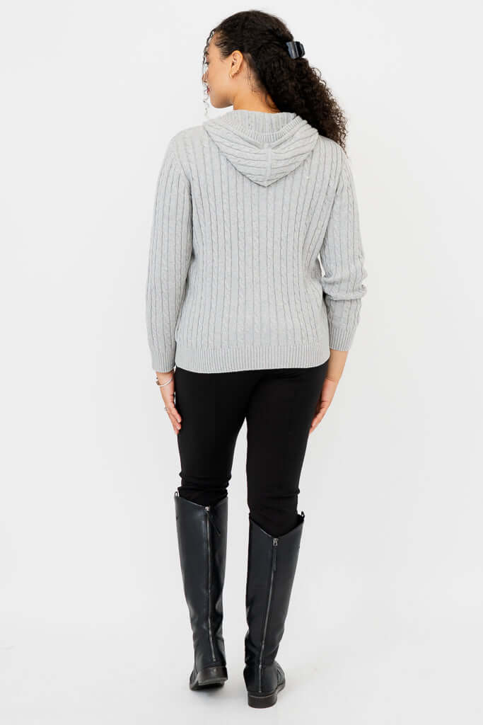 Back view showing hood and cable knit texture on a light grey sweater hoodie
