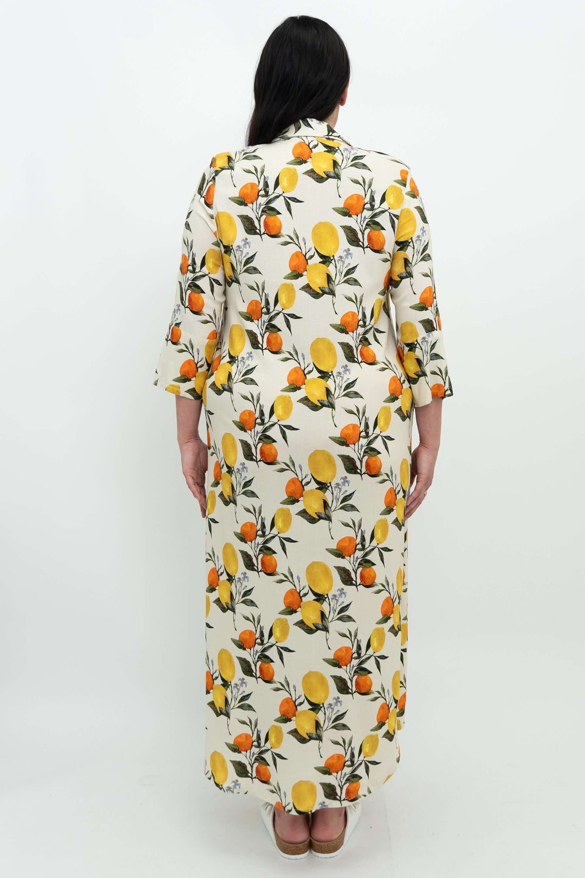 Back view of woman wearing linen bamboo citrus maxi shirt dress