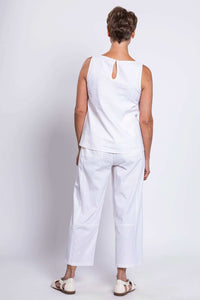 Back view of woman in white linen blend tank showing button closure