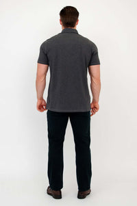 Back view of man wearing a dark grey bamboo polo shirt
