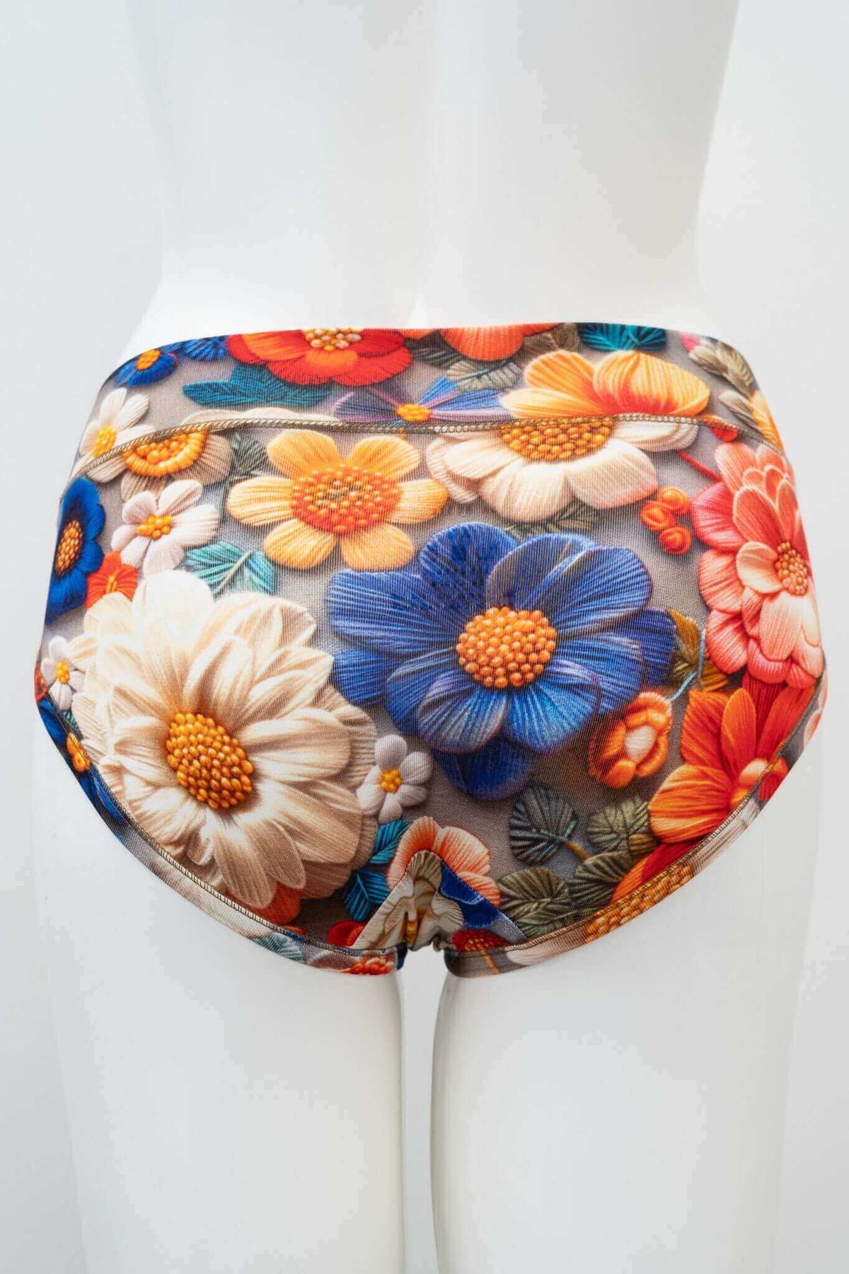 Back view of mesh floral briefs on mannequin