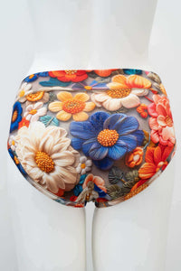 Back view of mesh floral briefs on mannequin