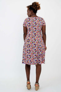 Back view of model in a multicolored floral A-line dress