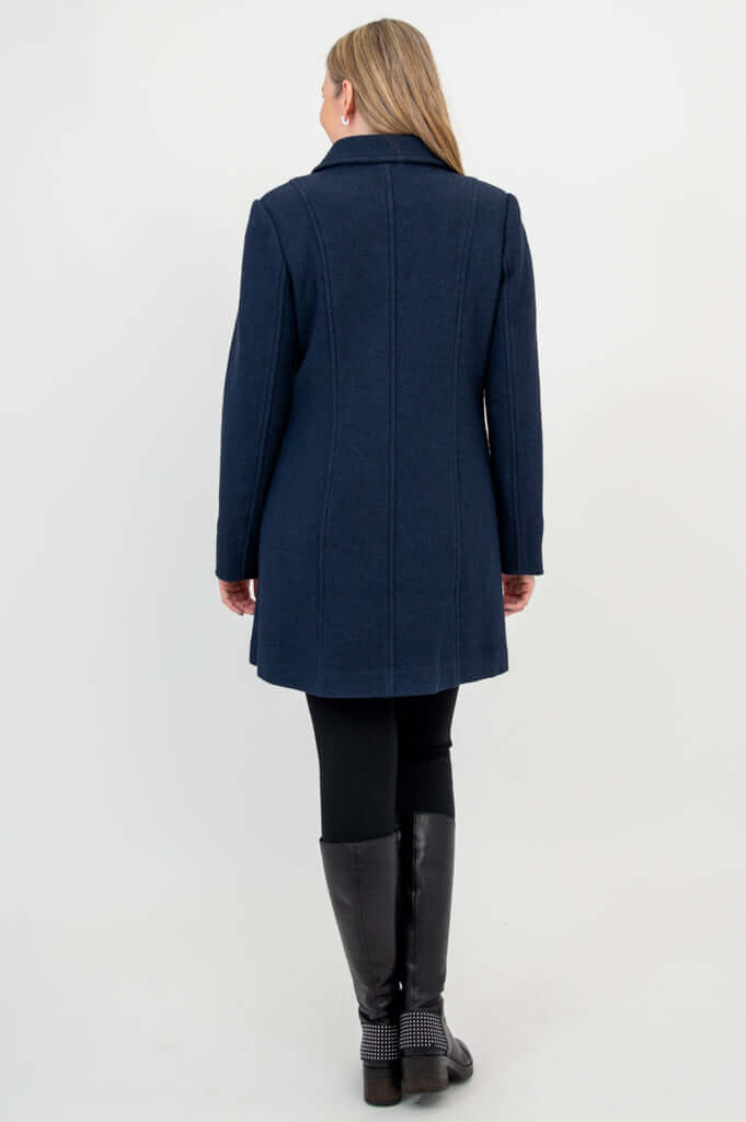 Back view of woman wearing navy double-breasted wool pea coat