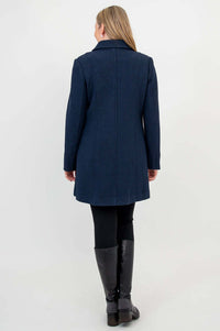 Back view of woman wearing navy double-breasted wool pea coat