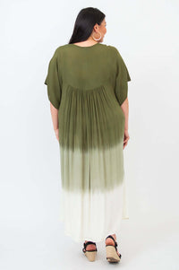 Back view of a woman wearing an olive ombre maxi dress to reveal the gathered back design