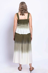 Back view of a woman wearing an olive ombre maxi skirt and matching top.