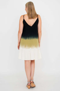 Back view of woman in ombre knee-length tiered dress showing V-back detail