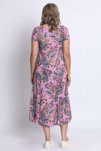 Back view of a woman wearing a pink paisley print midi dress