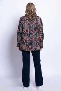 Back view of a woman wearing a plaid cotton jacket with long sleeves