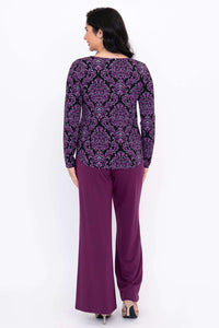 Back view of model wearing purple damask bamboo top with long sleeves