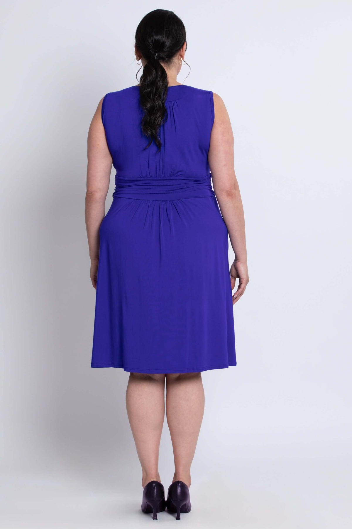 Back view of model wearing sleeveless purple bamboo dress