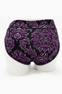 Back view of purple and black flourish print hipster underwear on mannequin