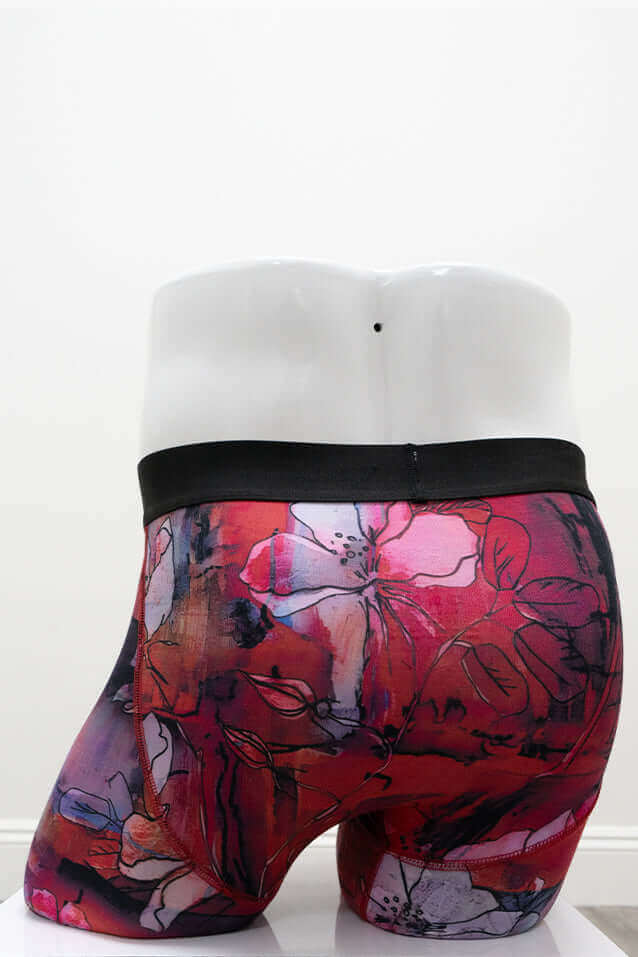 Back view of red floral bamboo men's underwear on mannequin displaying floral pattern