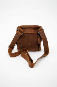 Back view of the vintage brown leather crossbody bag with adjustable strap