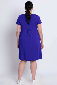 Back view of woman wearing violet bamboo dress showing relaxed fit