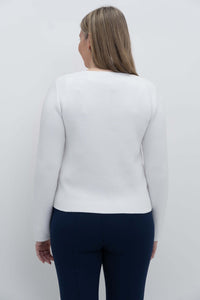 Back view of a woman wearing a white cardigan, showing the fit and length