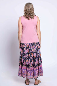 Back view of woman in Tibby floral skirt and pink tank top