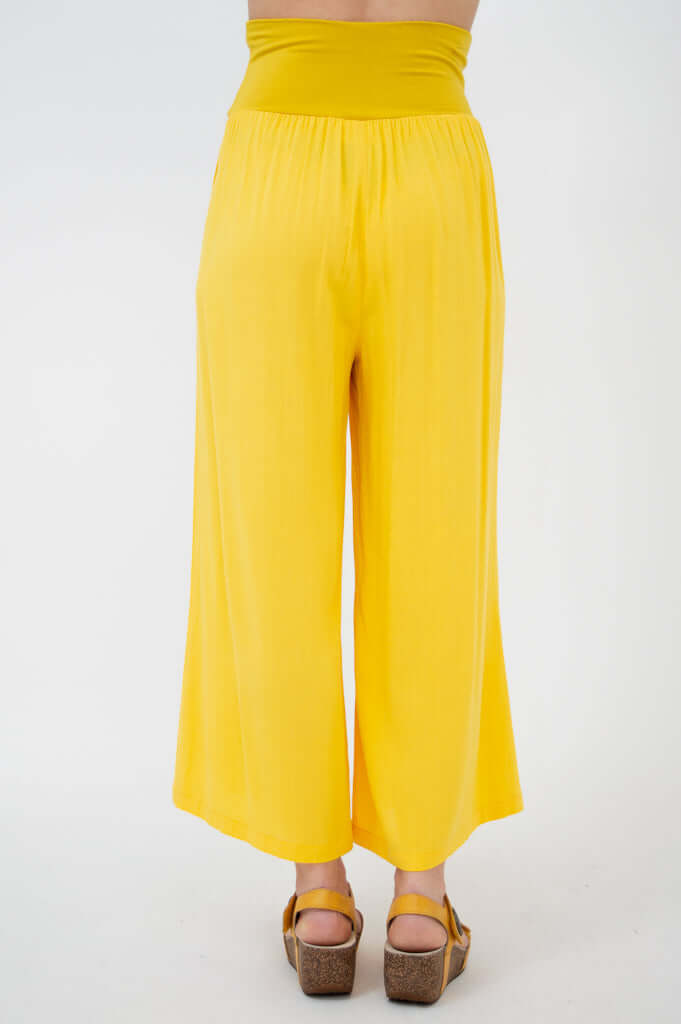 Back view of yellow wide-leg capri pants with high waistband