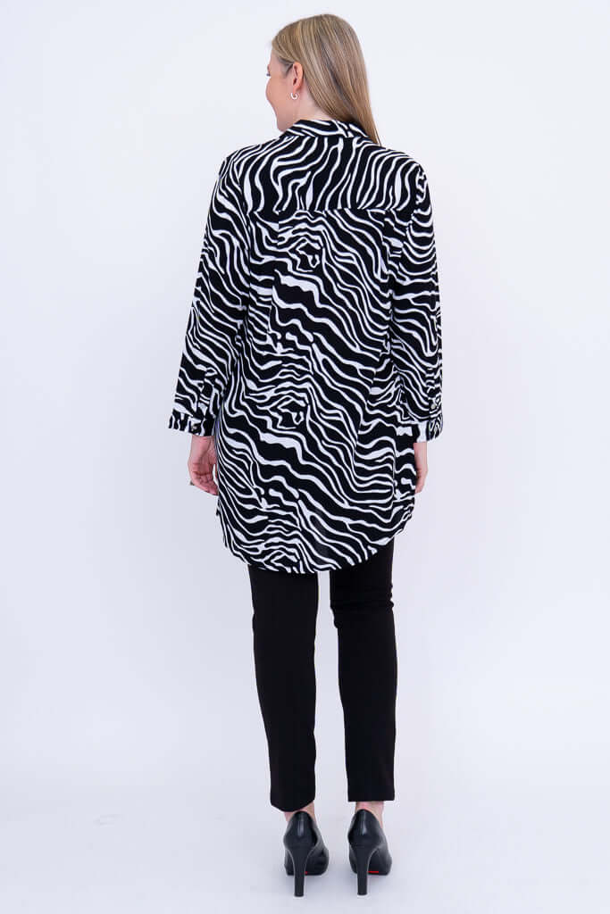 Back view of woman wearing a zebra batik print tunic shirt