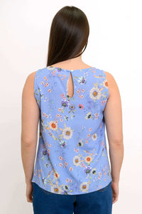 Back view of a woman wearing the blue floral tank top with a button closure