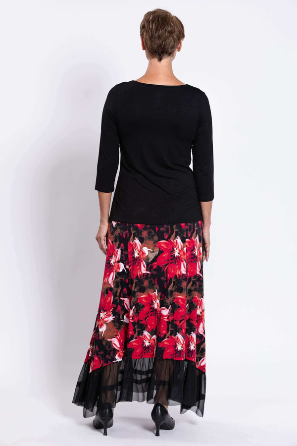 Back view of model in Vera floral maxi skirt showing mesh detail