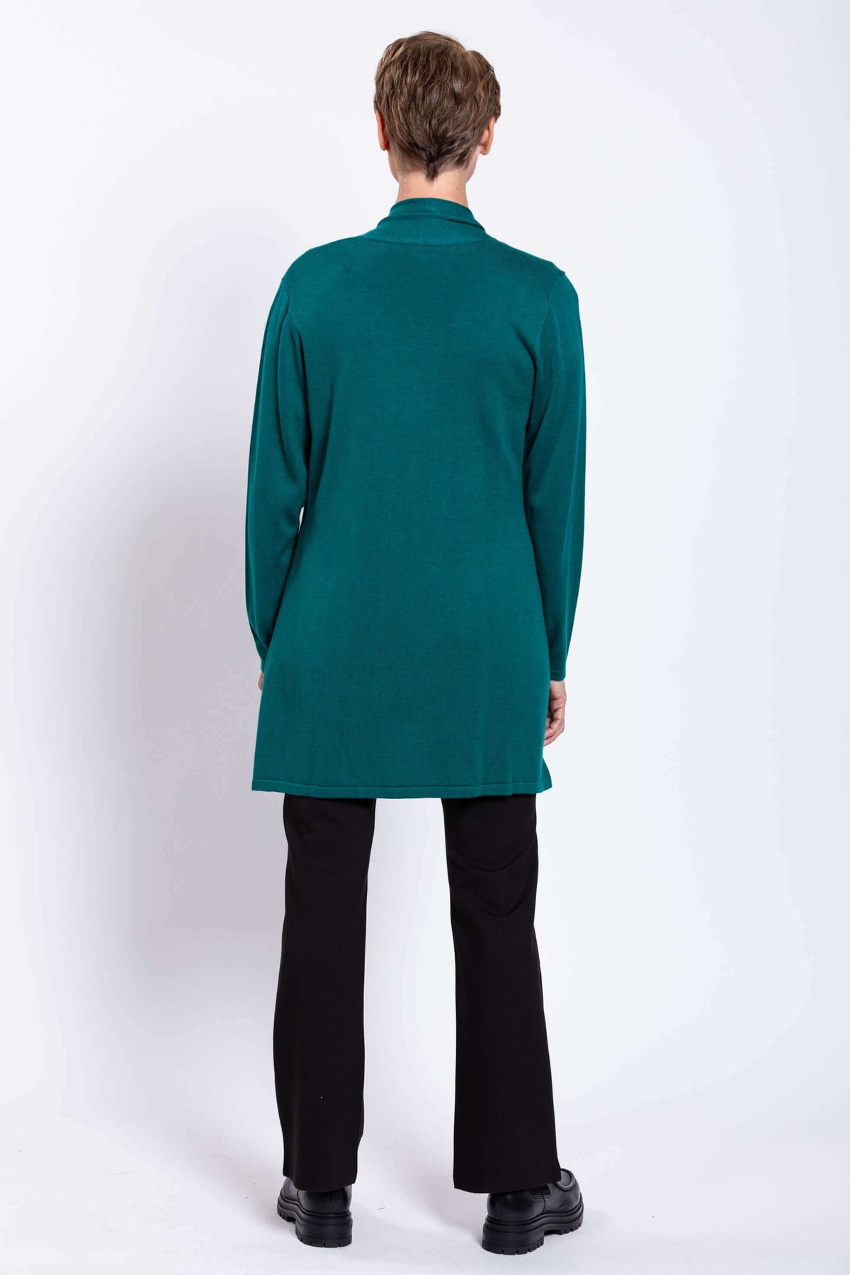 Back view of woman wearing teal Paige Sweater cardigan