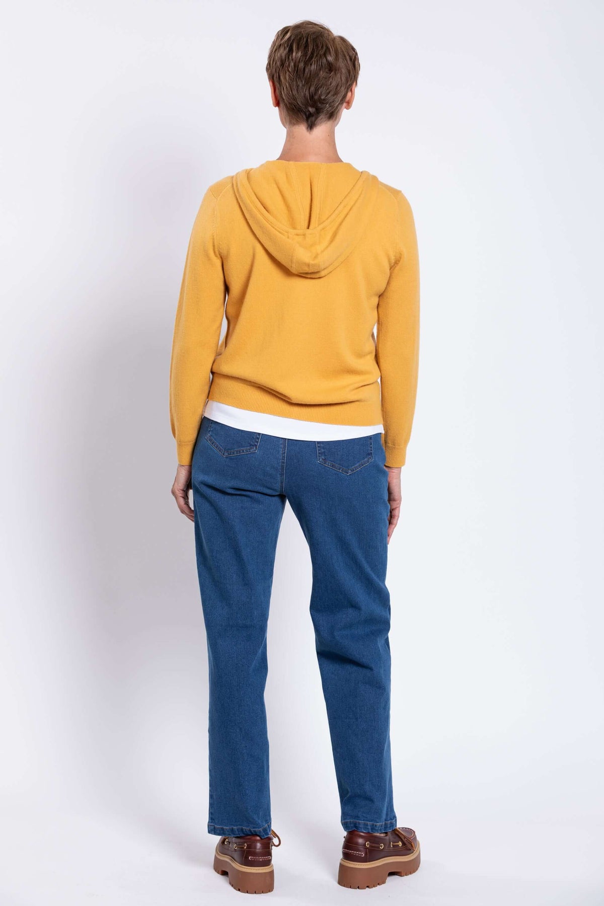 Back view of model in yellow wool cashmere zip hoodie