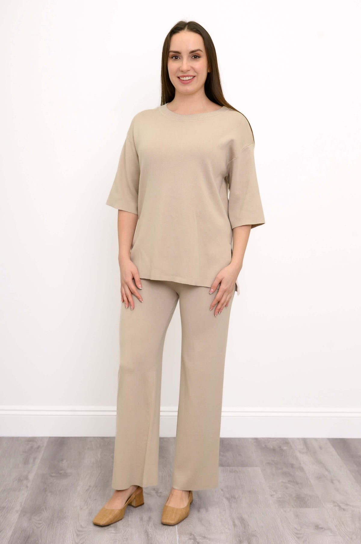 Front view of a woman wearing the beige Bailey Sweater.