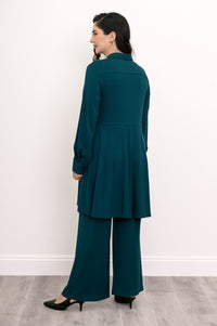 Straight-on back portrait of a women's teal long-sleeve knit tunic blouse with a skirted bottom.