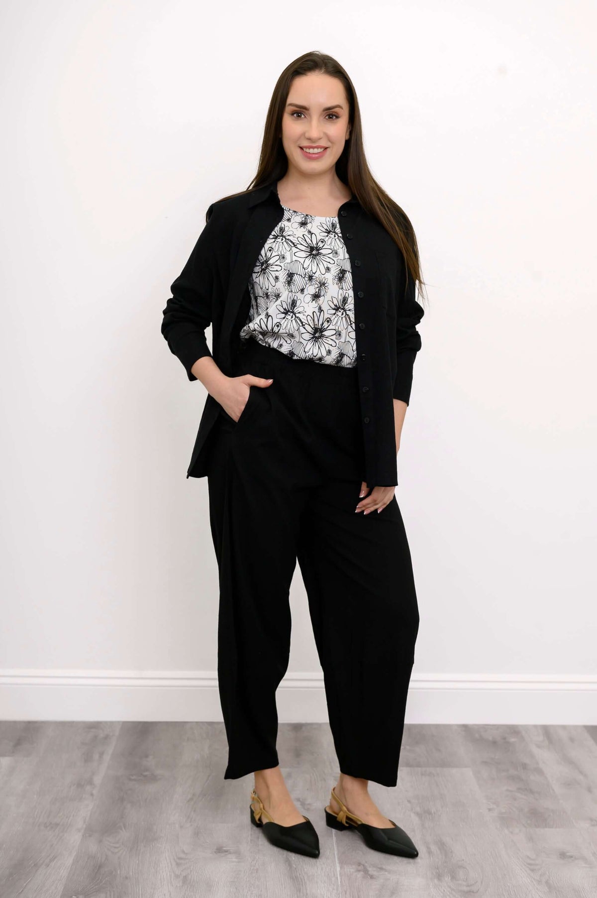 Black Boardwalk Pants styled with a monochrome floral blouse and black jacket