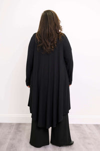 Back view of model wearing black high-low duster cardigan