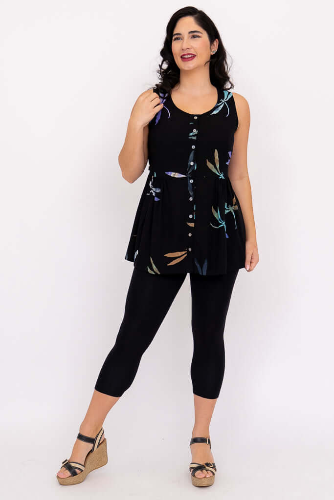 Woman in black batik tank with adjustable back ties and stylish dragonfly print