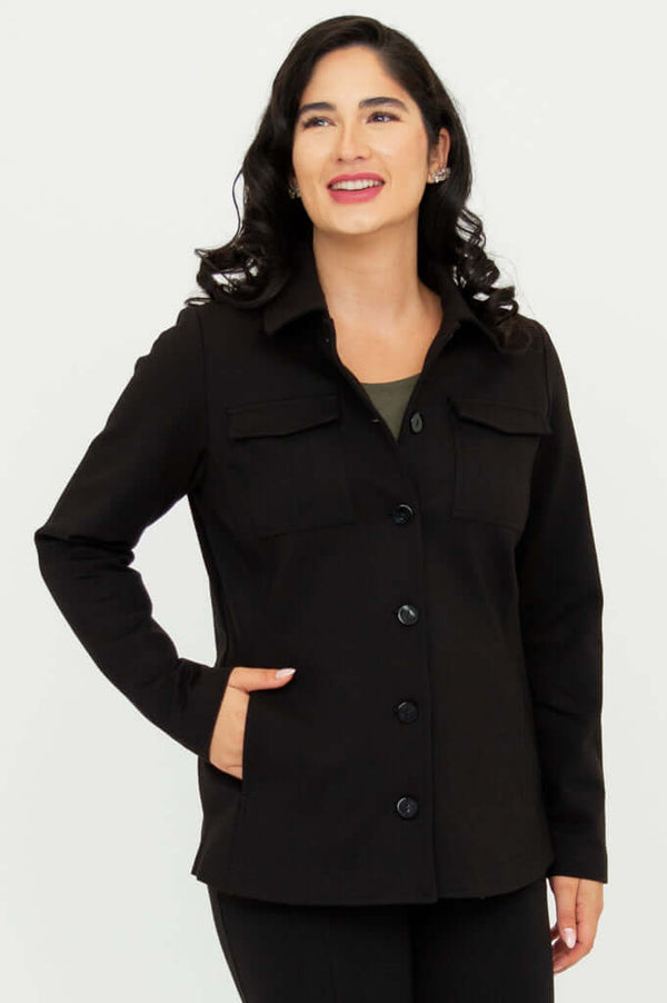 Woman wearing a black button-front jacket with patch and side pockets