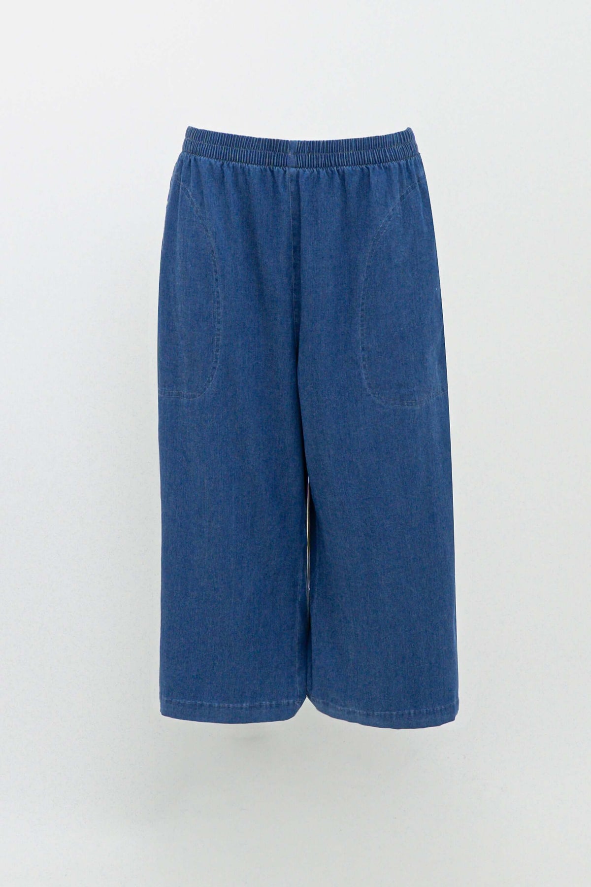 Front view of blue flowy tencel denim capris on white background