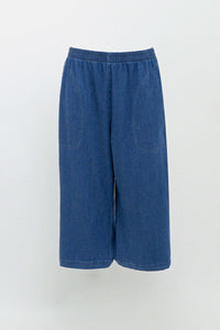 Front view of blue flowy tencel denim capris on white background
