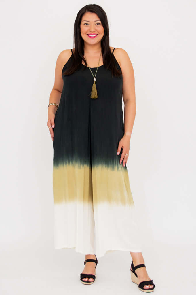 Three-quarter front view showing the flowy cut and tie-dye pattern of the ombre jumpsuit
