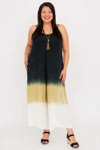 Three-quarter front view showing the flowy cut and tie-dye pattern of the ombre jumpsuit