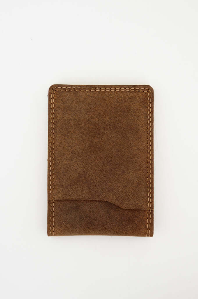 Back view of a closed brown buffalo leather slim wallet on white background