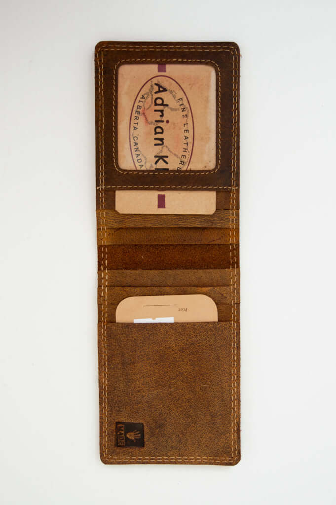 Open brown buffalo leather wallet showing multiple card slots and ID window