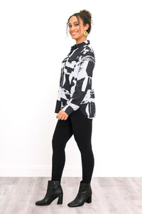 Profile shot of a relaxed-fit linen bamboo blend shirt featuring an abstract black and white block pattern.
