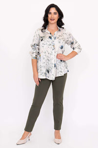 Woman with hand on hip wearing Charlotte Blouse with rolled sleeves
