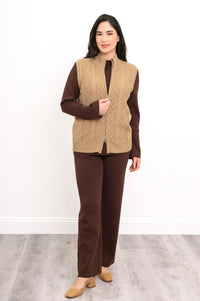 Sleeveless cotton sweater vest with vertical cabling and silver-colored zippers, shown from an active side angle
