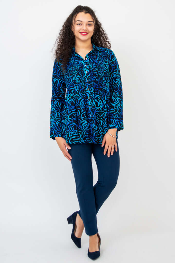 Full front view of model in Cindy shirt and navy pants with heels