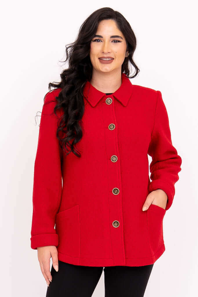 Front view of a woman wearing a classic red wool blend coat with bronze buttons