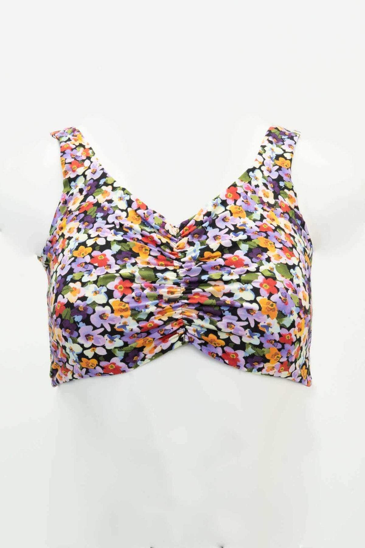 Front view of the Clipper Top in a colorful floral pattern with wide straps and cinched neckline