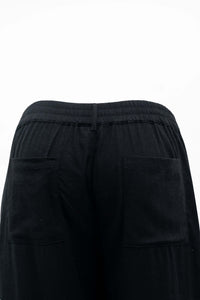 Close-up of black Melodie Pant waistband and back pockets