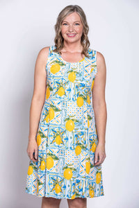 Model smiling in Arden dress with lemon tile print, close-up front view