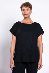 Close-up front view of woman in black linen blend tee