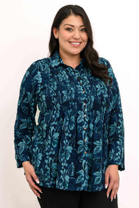 Close-up of woman wearing The Cindy blue floral smocked top with buttons